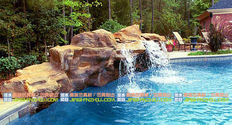 水泥假山搭配绿植树木流水瀑布仿造自然界的壮观奇景